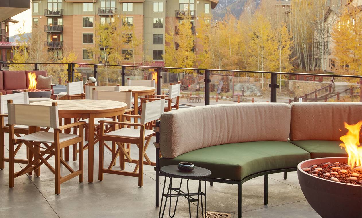 outdoor patio with dining area and fire pit