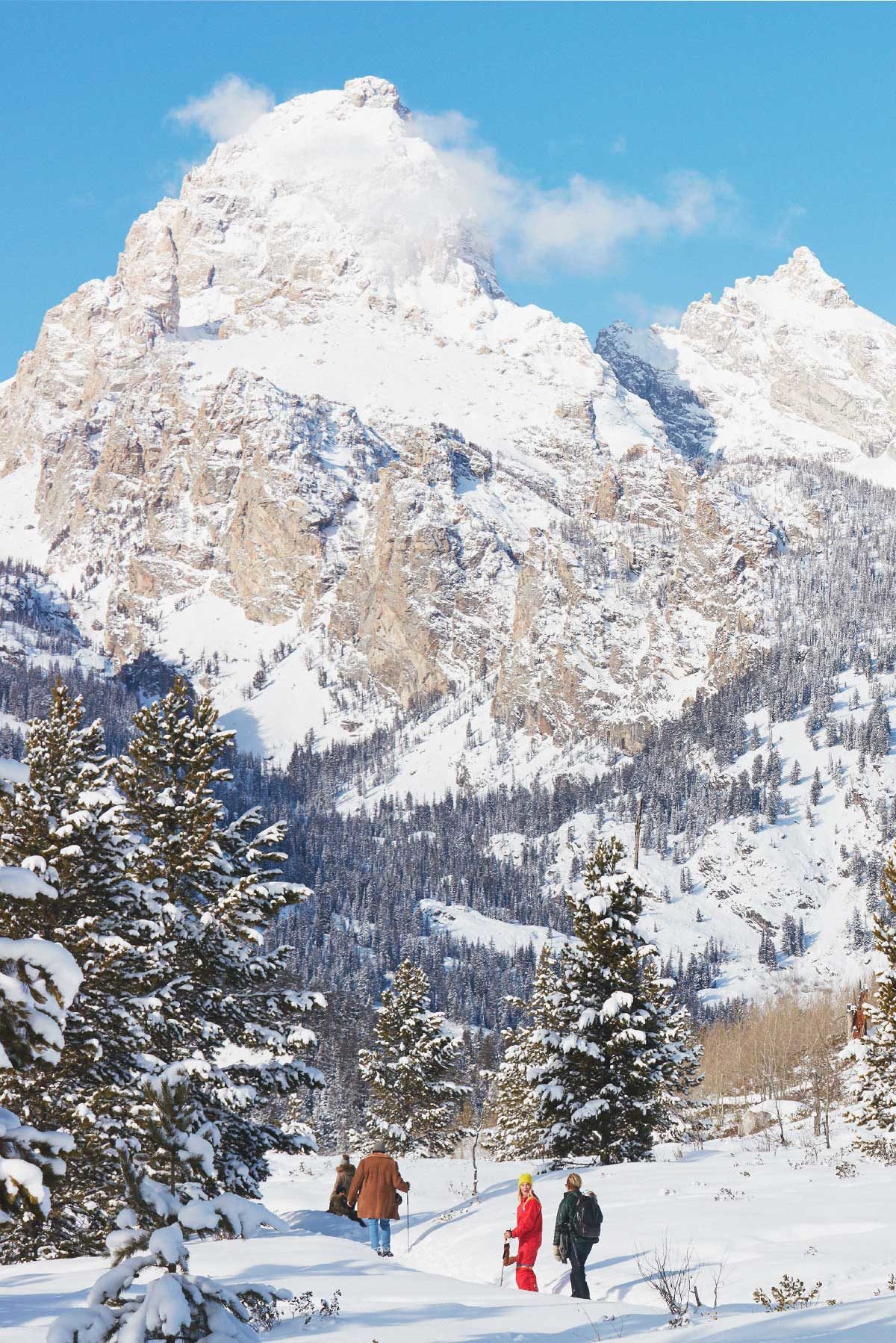 People snow shoeing in the mountains