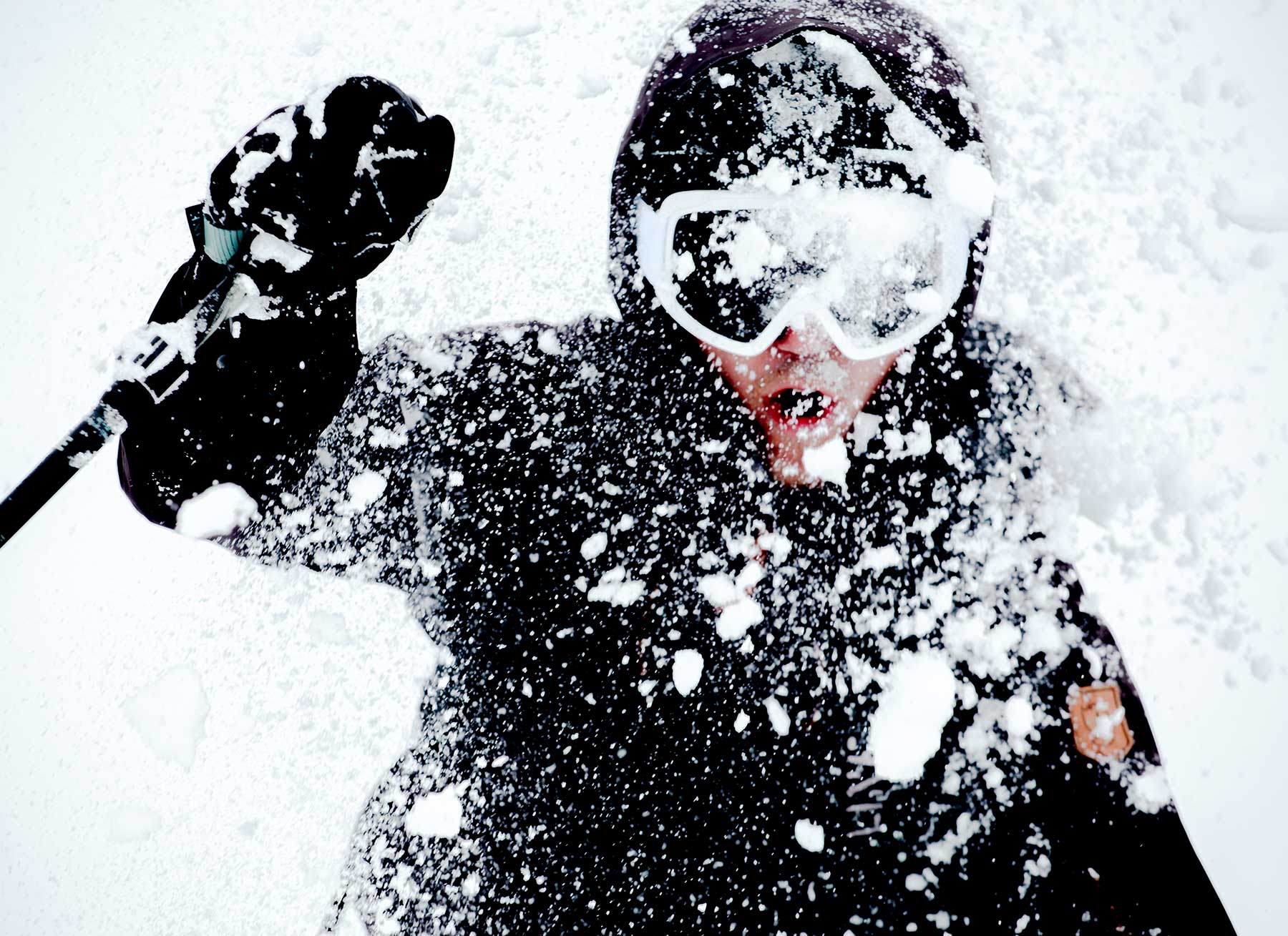 Skier with snow on face