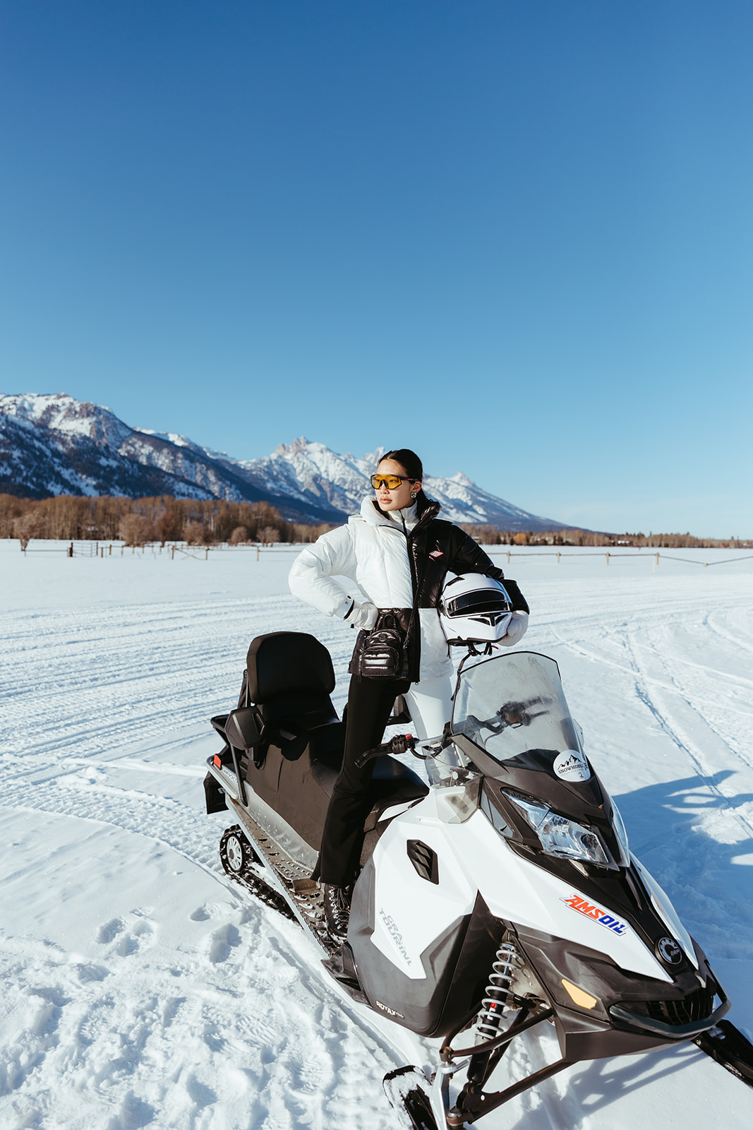 Woman on snow mobile